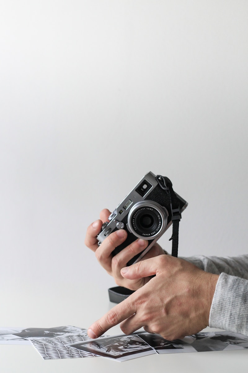 Photo by NordWood Themes person holding camera